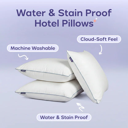 Stack of three water and stain proof hotel pillows, machine washable with cloud-soft feel.